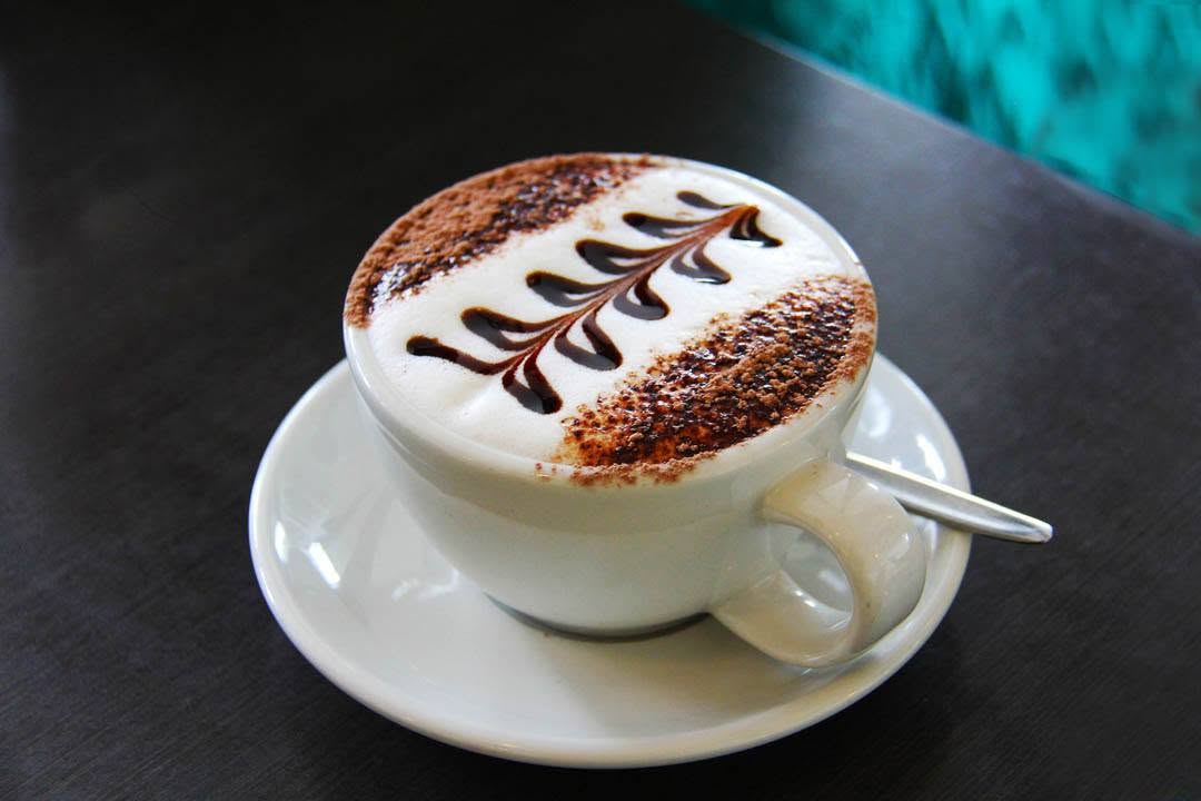 Latte art cappuccino made fresh at The Daily Dose