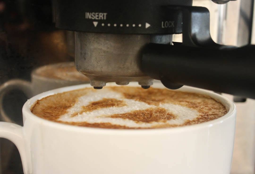 Pulling a fresh espresso shot at The Daily Dose coffee bar